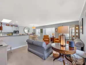 From the main entry, looking into the living room, dining room, and kitchen.