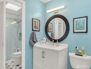 Bath with walk in shower.