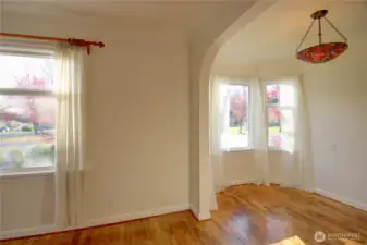 The dining nook.  The park is visible through the curtains.