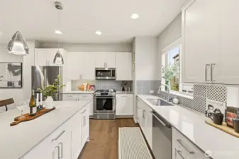 Chef’s kitchen offering generous counter space and a clean, modern design