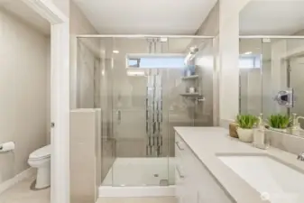 Spa-inspired primary bath with oversized walk-in shower