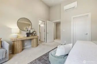 Alternate view of the spacious primary suite showcasing abundant natural light