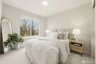 Comfortable secondary bedroom with bright windows and versatile layout