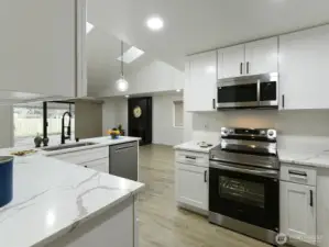 White Quartz counter tops.  All Stainless appliances new.  New custom cabinets w/ handles and Recessed lighting too.