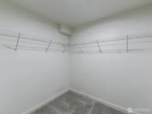 Attached Primary closet with white wire racks.