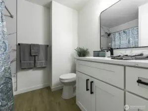 2nd Bath. Quartz counter tops. New cabinets w/ handles.