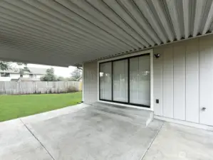 Outdoor Patio area. Double slider. Covered for entertaining.  New exterior Paint.
