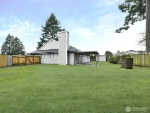 Side yard.  Fenced back yard. Over one quarter acre on cul-de-sac.  Gate on each side of home. Grass  has been staged more even green in areas.