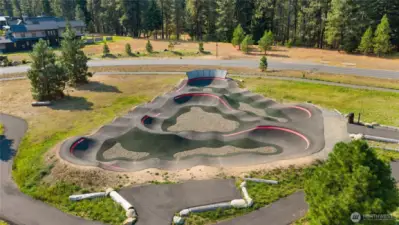 Nelson Farm pump track: a fun, rider-friendly course for bikes, scooters, and skate-style riding at any age.