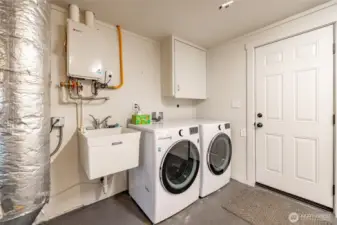 Hot water on demand, utility sink and newer washer/dryer