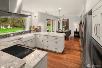Remodeled kitchen with gorgeous highly detailed slab granite, stainless appliances and huge kitchen widow overlooking nature.