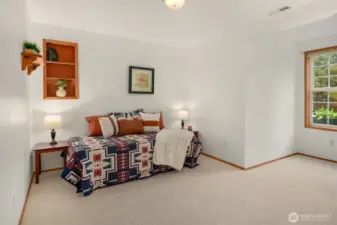 Bedroom #2 with new carpet. Great nook to create a window seat!