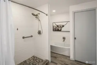 Primary Bathroom Featuring Tub & Walk-In Shower.