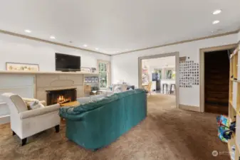 Large living room with hardwoods under carpet