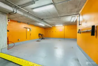 Dedicated car washing bay in garage.