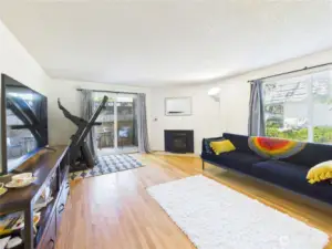 Living room to deck. Hardwood floors.