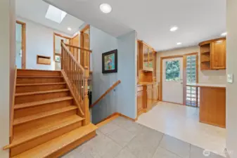 Lovely wide tile foyer at the entry