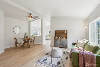 Spacious floor plan with vaulted ceilings, fan, and a versatile space.