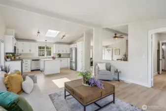 From the back of the house, you can see the kitchen and appreciate the multiple spaces this home offers.