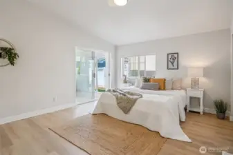 Very spacious primary bedroom, with slider to access the bonus room.