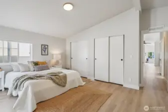 Primary bedroom with double closets.