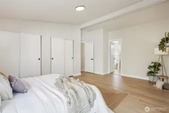 Primary bedroom with ensuite bathroom. Vaulted ceilings, new interior paint and LVP floors, hardware, light fixtures, and trim.