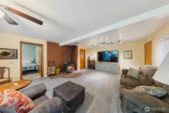 Downstairs offers a spacious family room, 2 bedrooms and a bathroom plus a mud room.