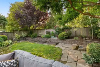 Extensive hardscaping & mature landscaping