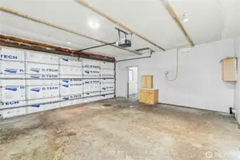 Garage with door to shop area