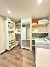 Built in shelving in an oversized laundry room/closet!
