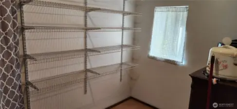 Small second bedroom is currently used for an office/storage