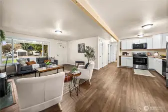 Open-concept living space ideal for entertaining. Let's go see the bedrooms.