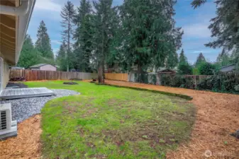 Fully fenced yard offers privacy and versatility