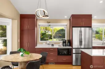 Custom cabinetry, dining nook and coffee bar.