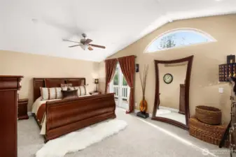 Primary suite with new carpet, walk-in closet, vaulted ceilings and a full ensuite.