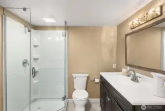 Lower level bath with a shower.