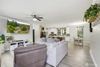 Welcoming entry opens into a bright, airy living space with soaring vaulted ceilings.