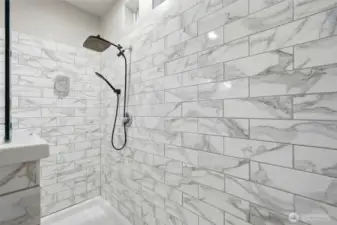 Separate oversized walk-in shower offers a clean, modern feel.