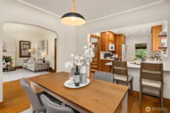 Dining room with seamless flow into kitchen & living room.