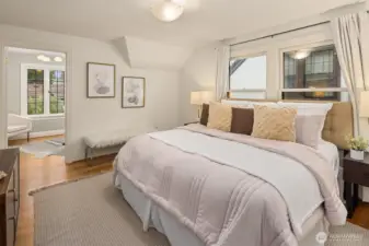 Upstairs primary bedroom with adjoining room ideal for a home office, nursery, or generous walk-in closet.