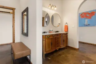 Don't miss the double vanity with waterfall faucets