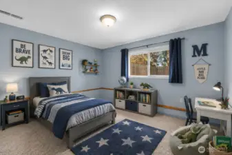 4th bedroom, downstairs. This room is virtually staged