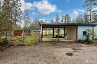 Detached 2-car carport with additional shed storage