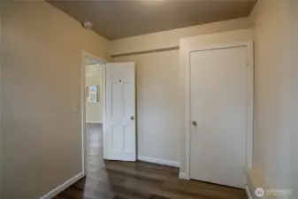 Lower unit bedroom 1 features new vinyl flooring installed in 2019