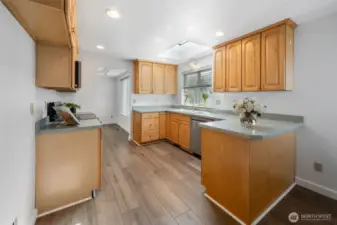 Kitchen with Skylight and window looking out to the backyard.