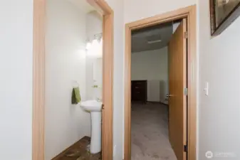 The half bath and hall goes to the primary suite.