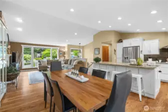 Beautiful oak hardwood flooring flows seamlessly throughout the common rooms blending the rooms harmoniously.