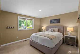 Several bedrooms on the main floor include plush new carpeting as well as a large window for brightness.