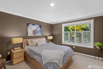 Beautiful plantation shutters provide a timeless accent to the room, enhancing its classic charm.