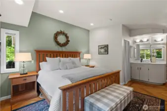 The spacious primary ensuite bedroom features a walk-in closet and a recently updated bathroom.